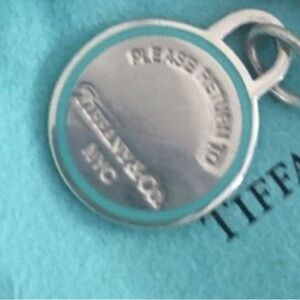 Tiffany & Co. Blue line Round charm only authentic w pouch. Firm price.L#1